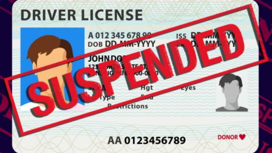 Cartoon image of a driver's license with the word "Suspended" across it in red